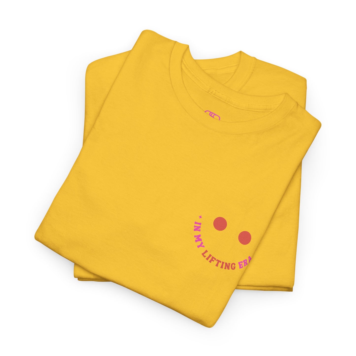 A folded daisy t-shirt with a retro smiley face on the front and the phrase “In my lifting Era” in a creative retro design on the back.
