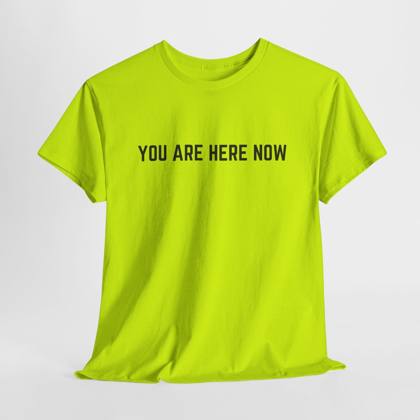 Front of a t-shirt with the grounding phrase "You are Here now" in a clean, minimalist font.
