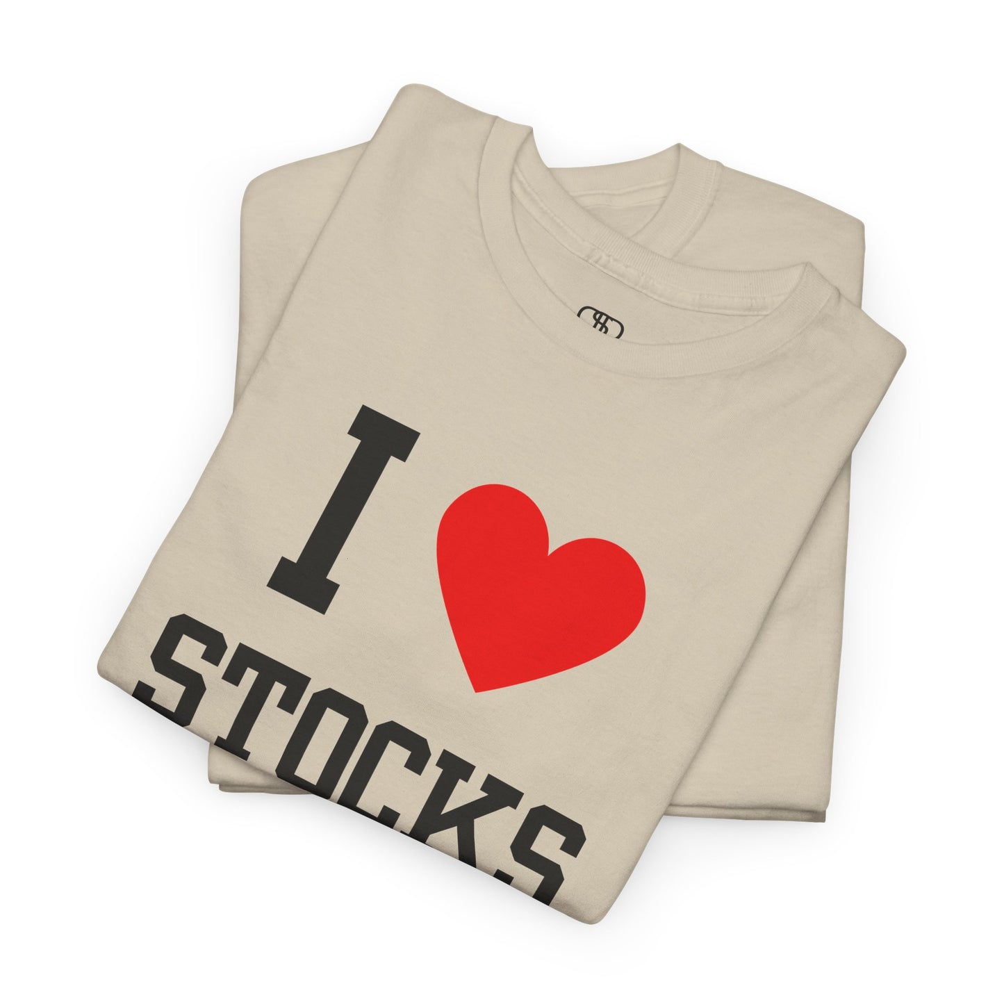 A sand t-shirt displaying the text "I," a red heart graphic symbolizing love, and the word "Stocks" in a classic, bold typeface.