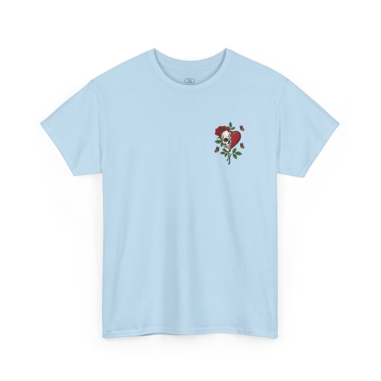 A light blue t-shirt with a front design of a half skull, half broken heart, and a rose. The back reads "Gym Heals" in red.