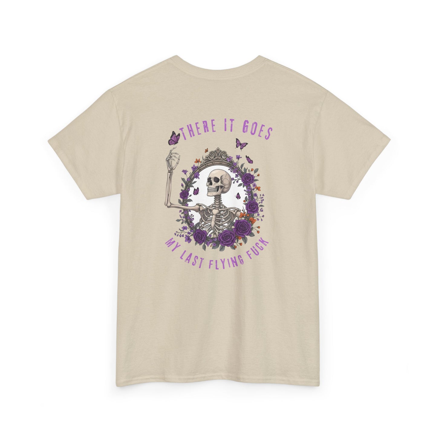 A sand t-shirt with a skeleton hand flipping its middle finger on the front surrounded by vines, roses, & butterflies, and a full skeleton design on the back with the phrase “My Last Flying Fuck.”