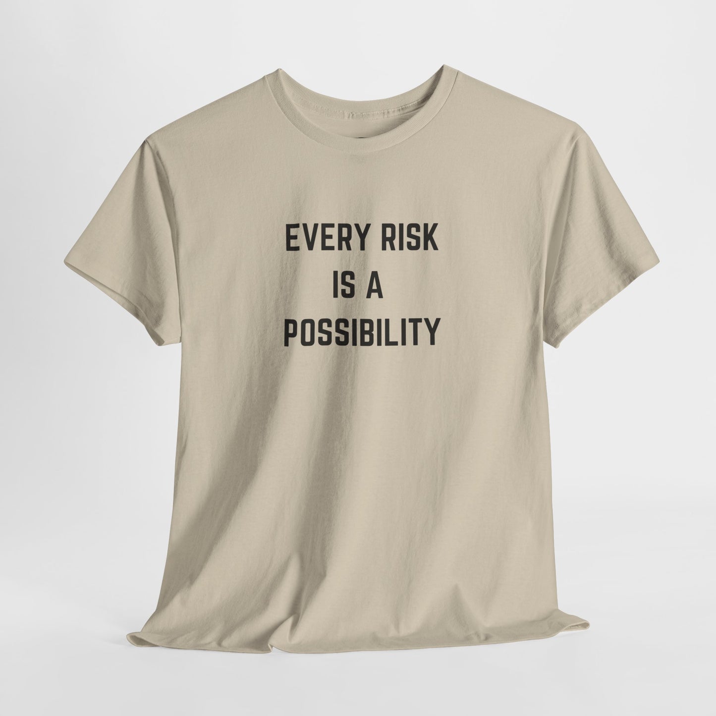 A t-shirt featuring the motivational quote "Every Risk Is a Possibility." in a clean, bold font.