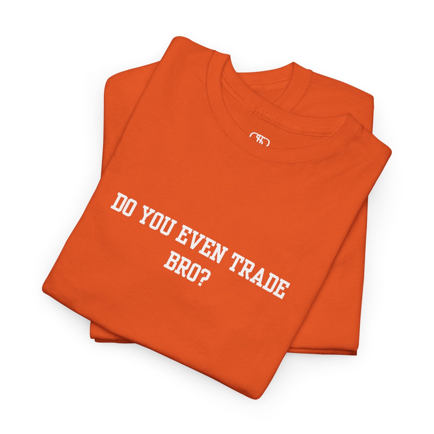 An orange t-shirt with the text "Do You Even Trade, Bro?" prominently displayed on the front. The shirt is shown in a clean, well-lit setting, highlighting the bold and humorous design.