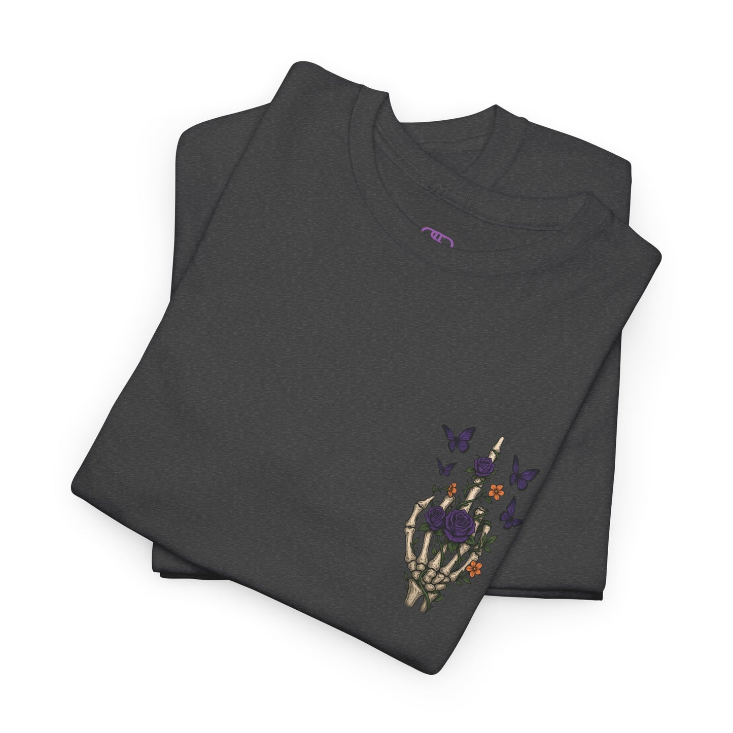 A dark heather t-shirt with a skeleton hand flipping its middle finger on the front surrounded by vines, roses, & butterflies, and a full skeleton design on the back with the phrase “My Last Flying Fuck.”