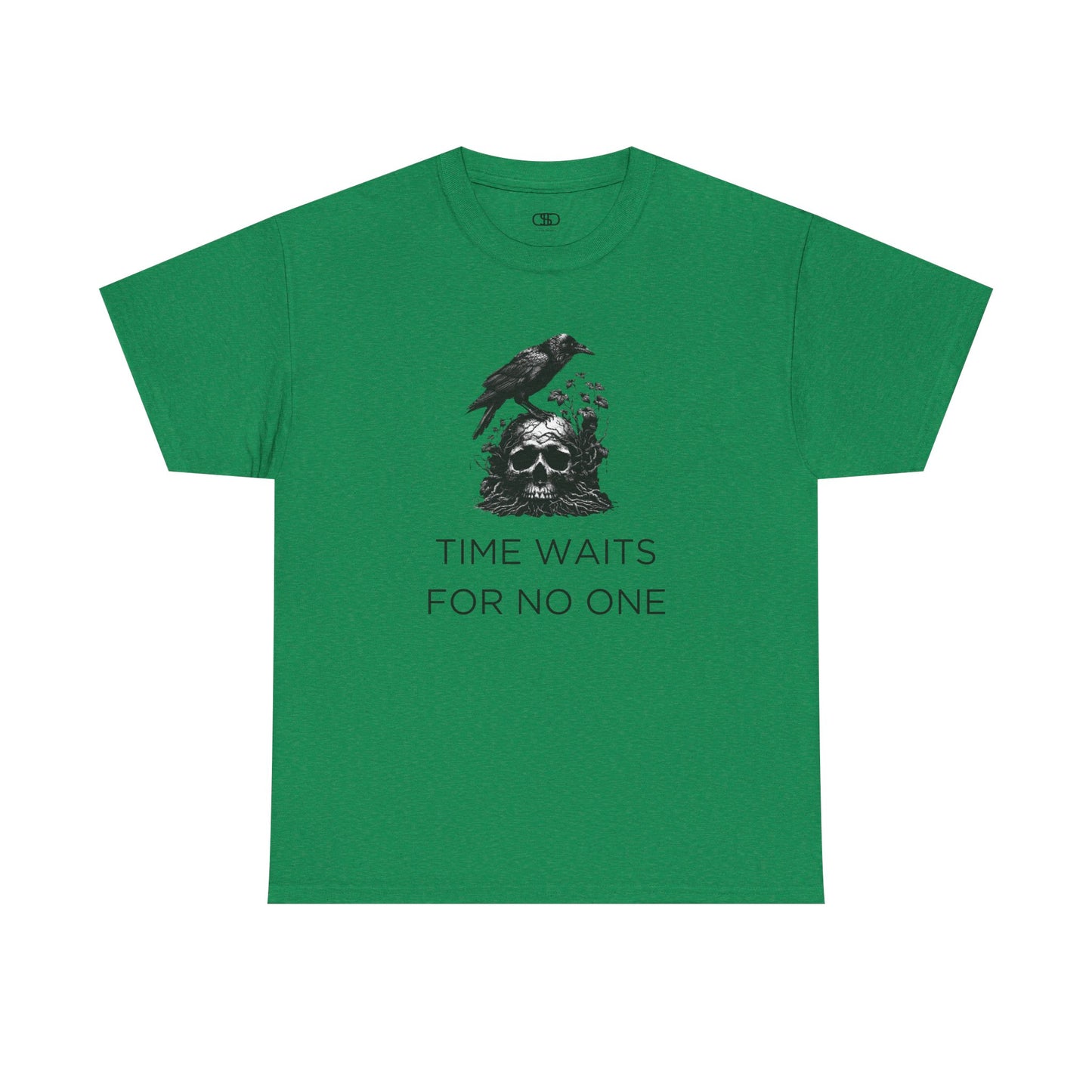 A close-up of a t-shirt with a gothic illustration. A black crow stands atop a weathered skull, which has moss and delicate vines growing through its eye sockets and around its form, blending nature and death.