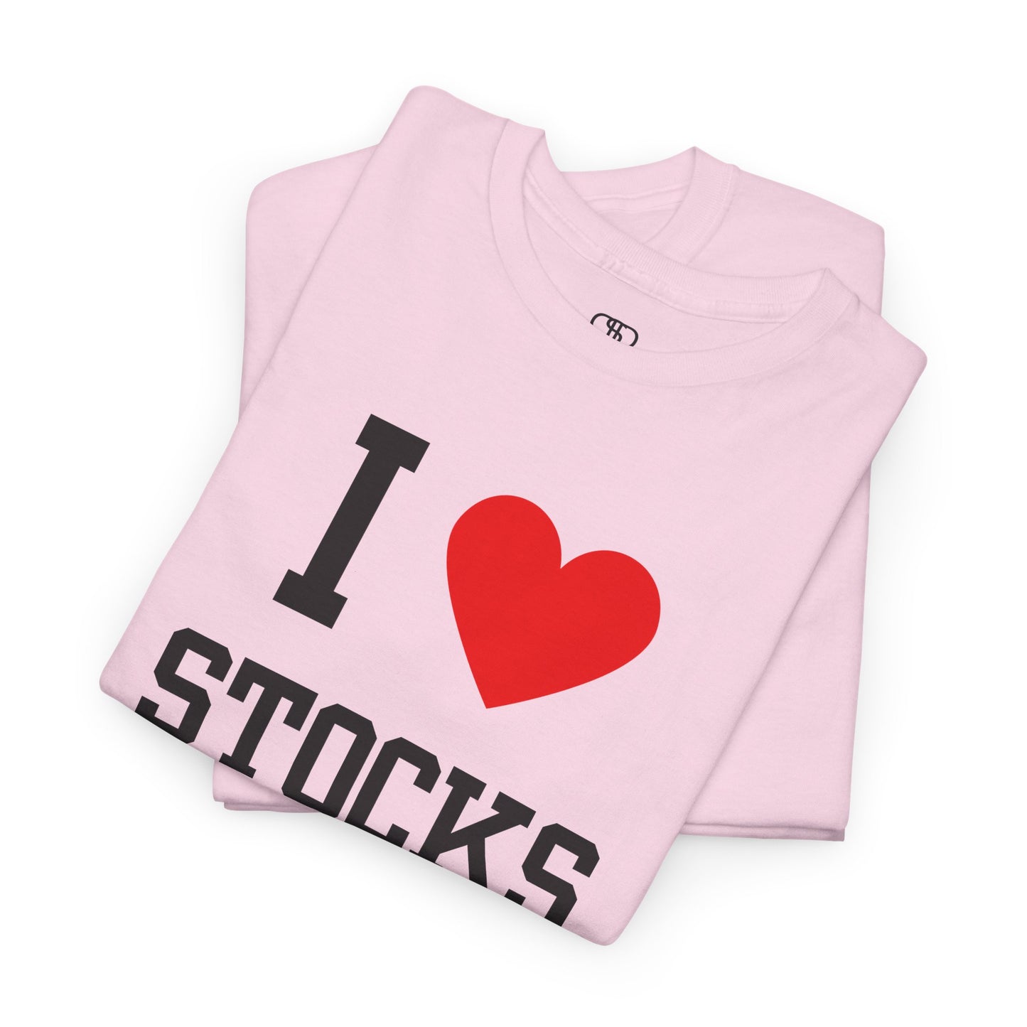 A light pink folded t-shirt displaying the text "I," a red heart graphic symbolizing love, and the word "Stocks" in a classic, bold typeface.