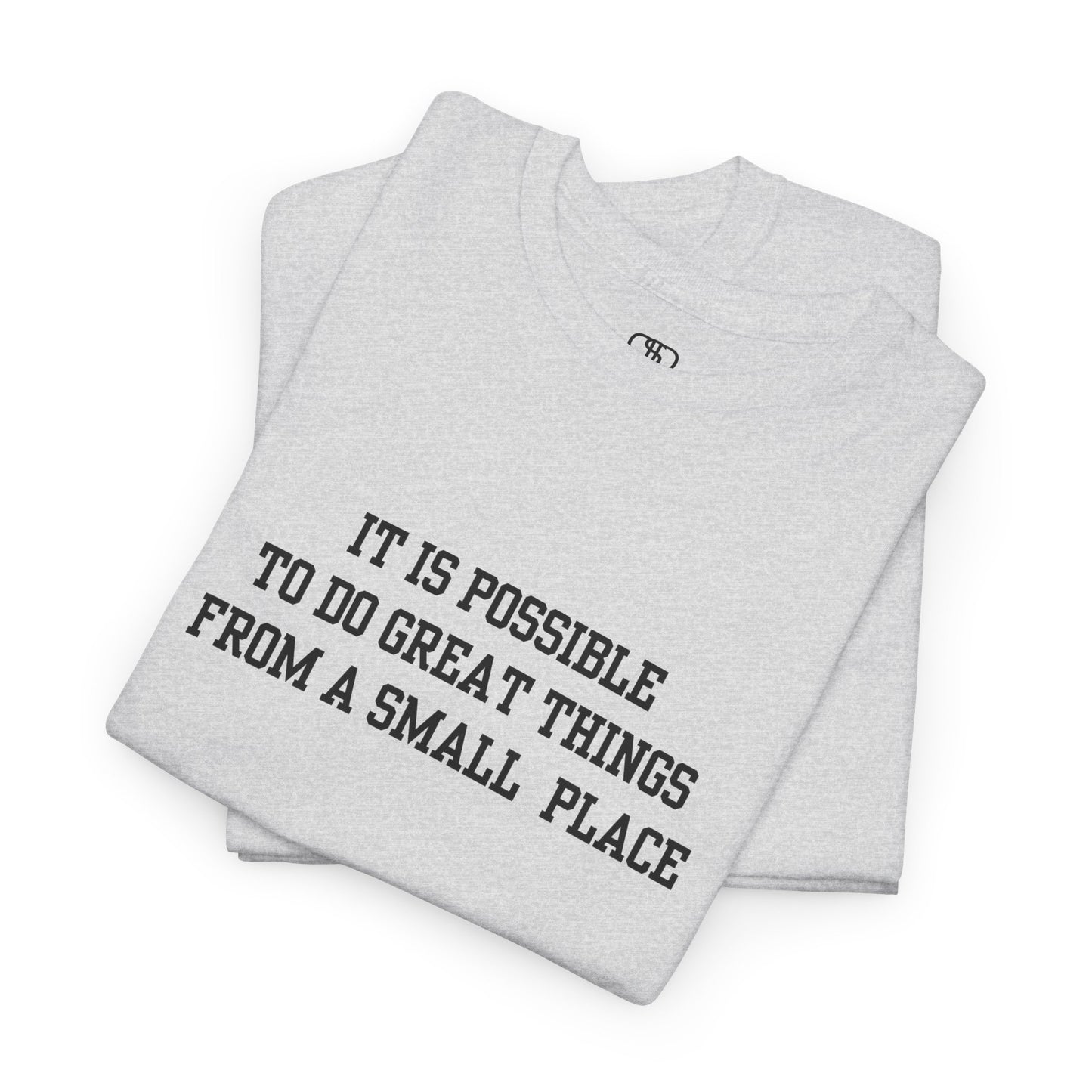 An ash gray t-shirt with the quote “It is possible to do great things from a small place” on the front.
