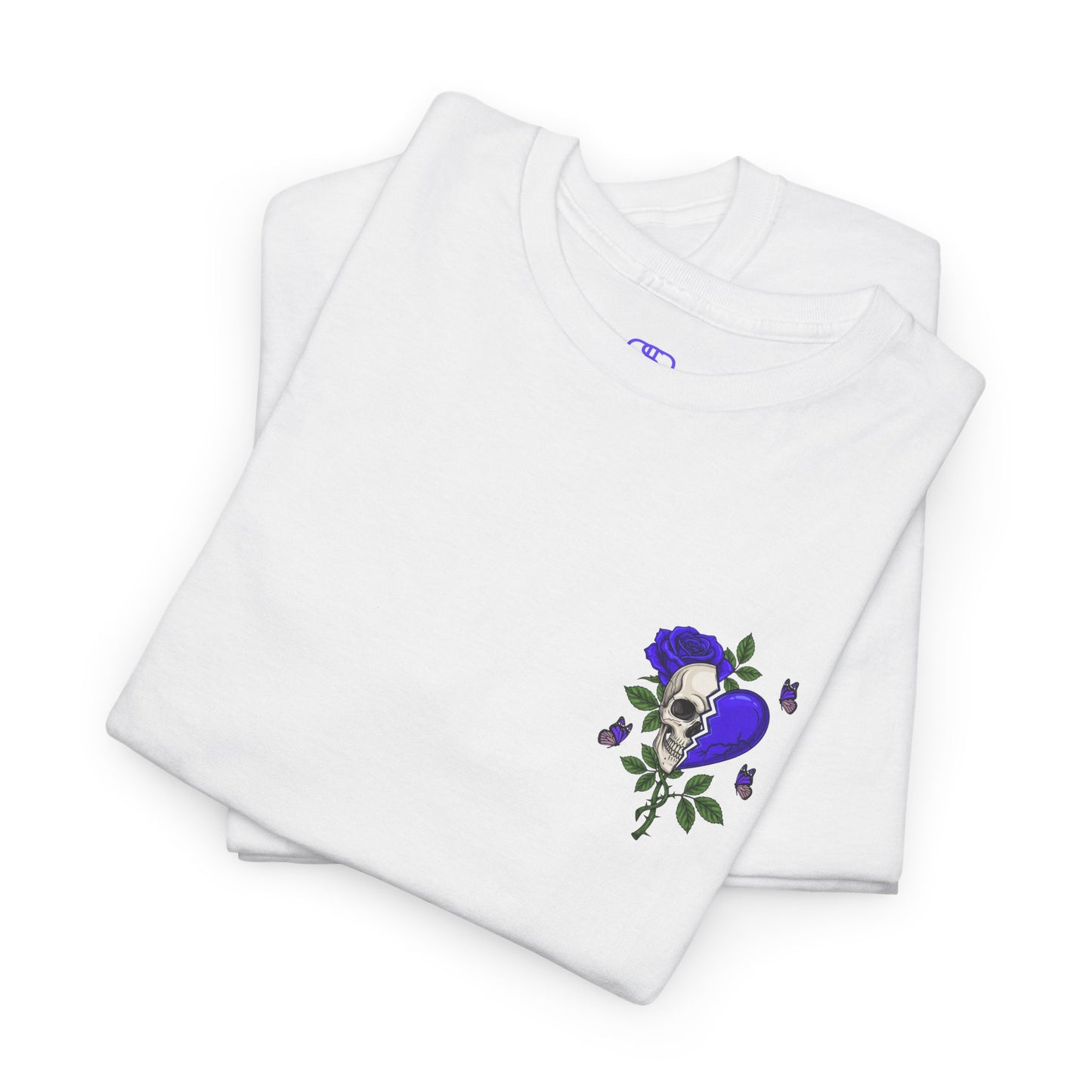 A folded white t-shirt with a front design of a half skull, half broken purple heart, and a rose. The back reads "Gym Heals" along with a similar design found on the front.