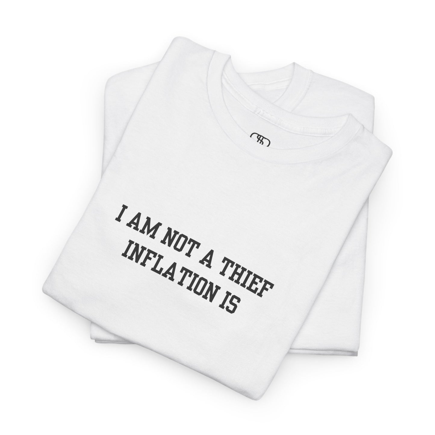 A folded white t-shirt with the phrase “I am not a thief Inflation is” on the front.