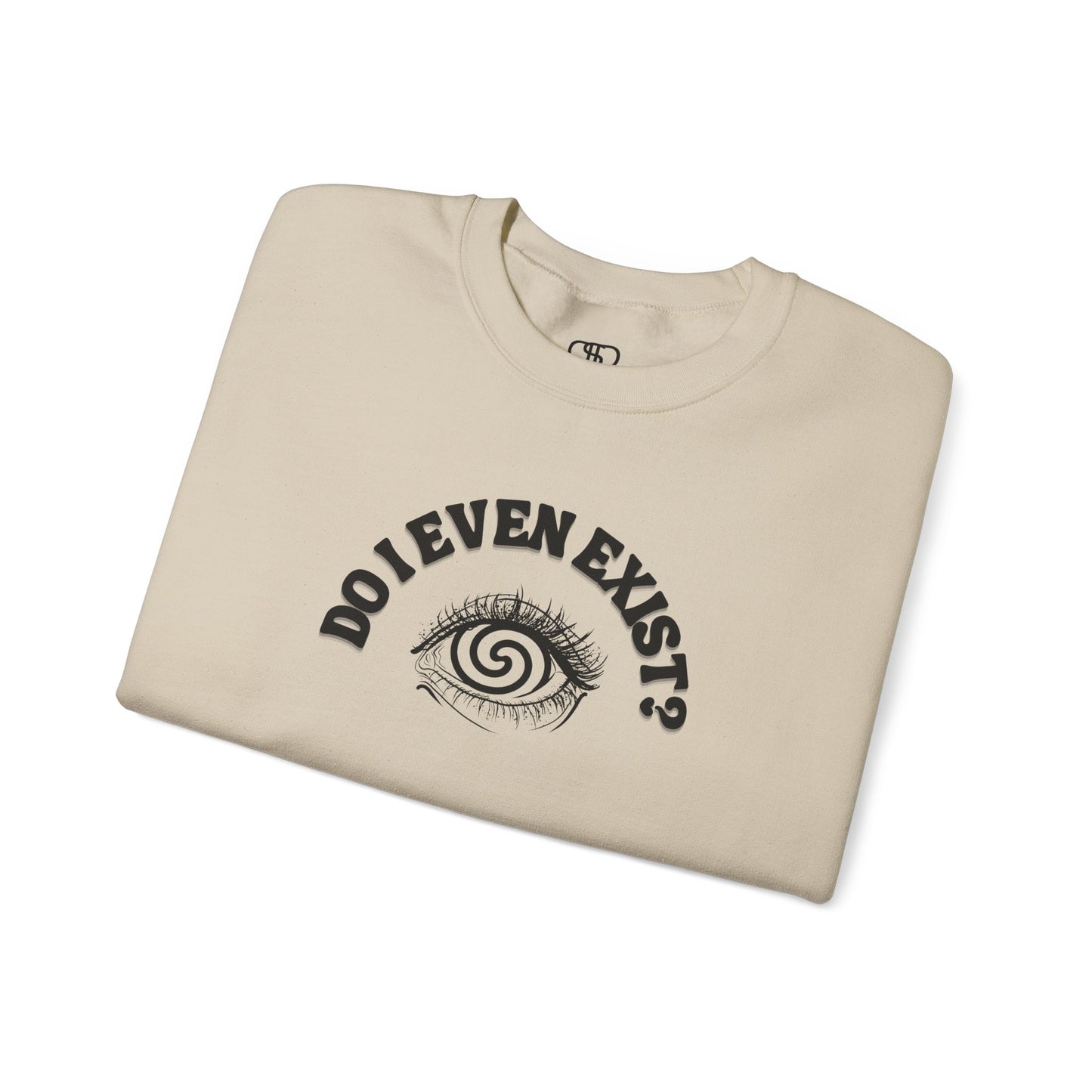 A folded sand sweatshirt with a graphic print of a detailed, realistic eye that contains an optical illusion of a spiral. The text "Do I even Exist?" is printed above the eye in a clean font.