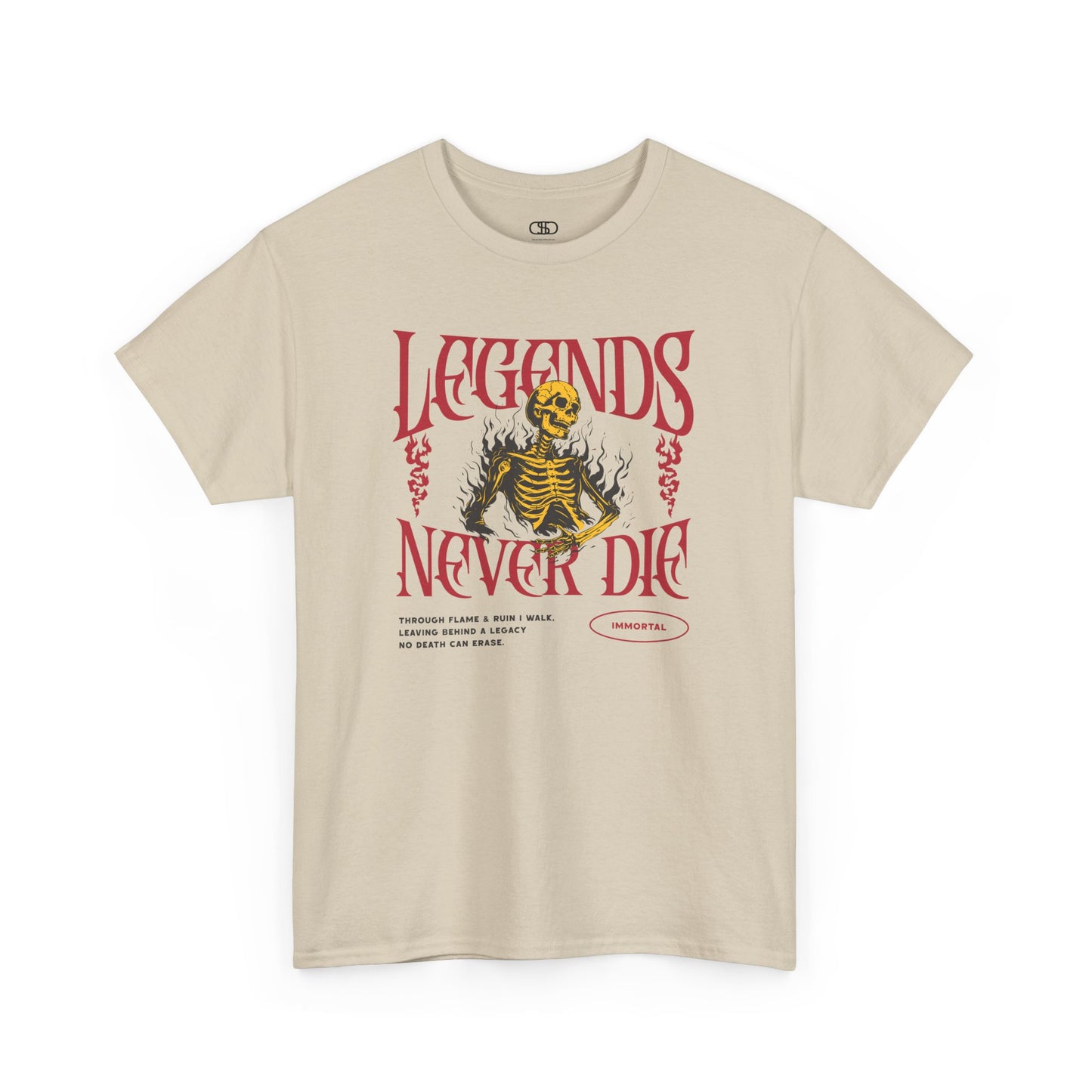 A sand t-shirt with a graphic of a defiant skeleton engulfed in flames. The words “Legends Never Die” are prominently displayed, with a smaller quote and the word “Immortal” included in the design.