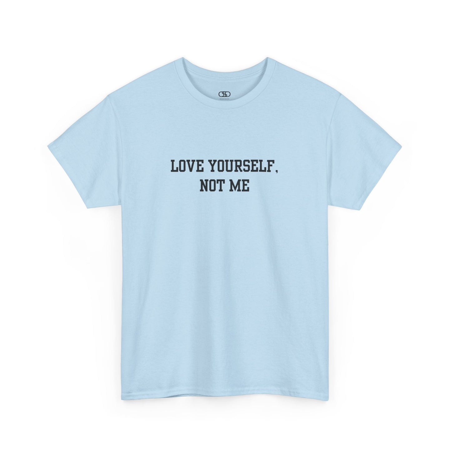 A minimalist light blue t-shirt with the bold, centered text "Love yourself, not me" in a clean, modern font.