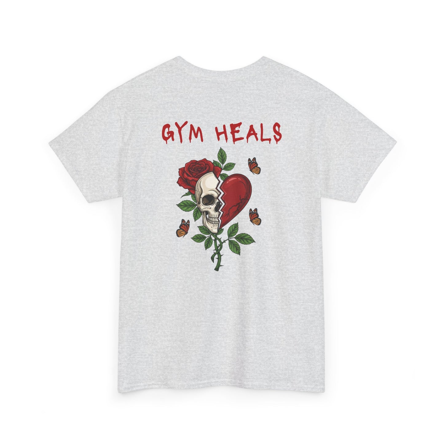 An ash gray t-shirt with a front design of a half skull, half broken heart, and a rose. The back reads "Gym Heals" in red.