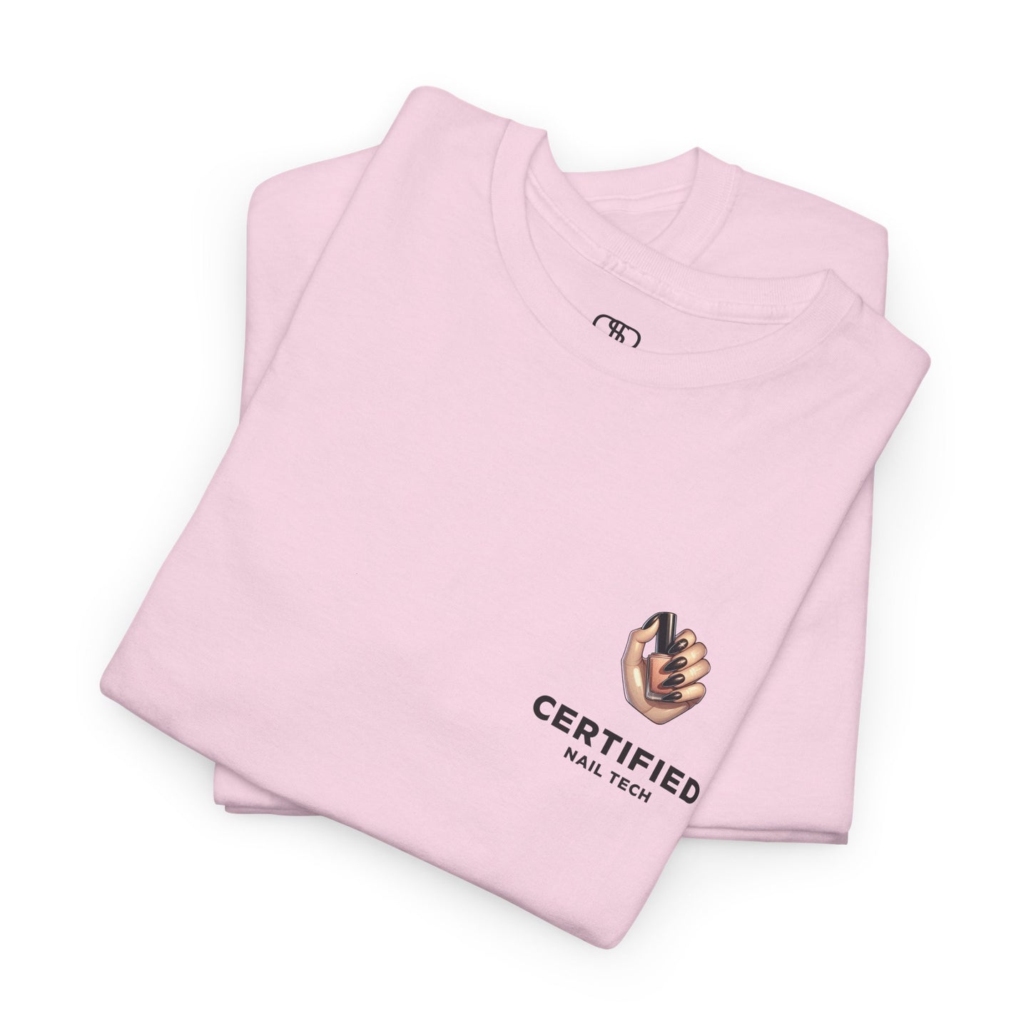 A folded light pink t-shirt with a hand graphic design holding nail polish with polished nails followed by the words Certified Nail Tech beneath it.