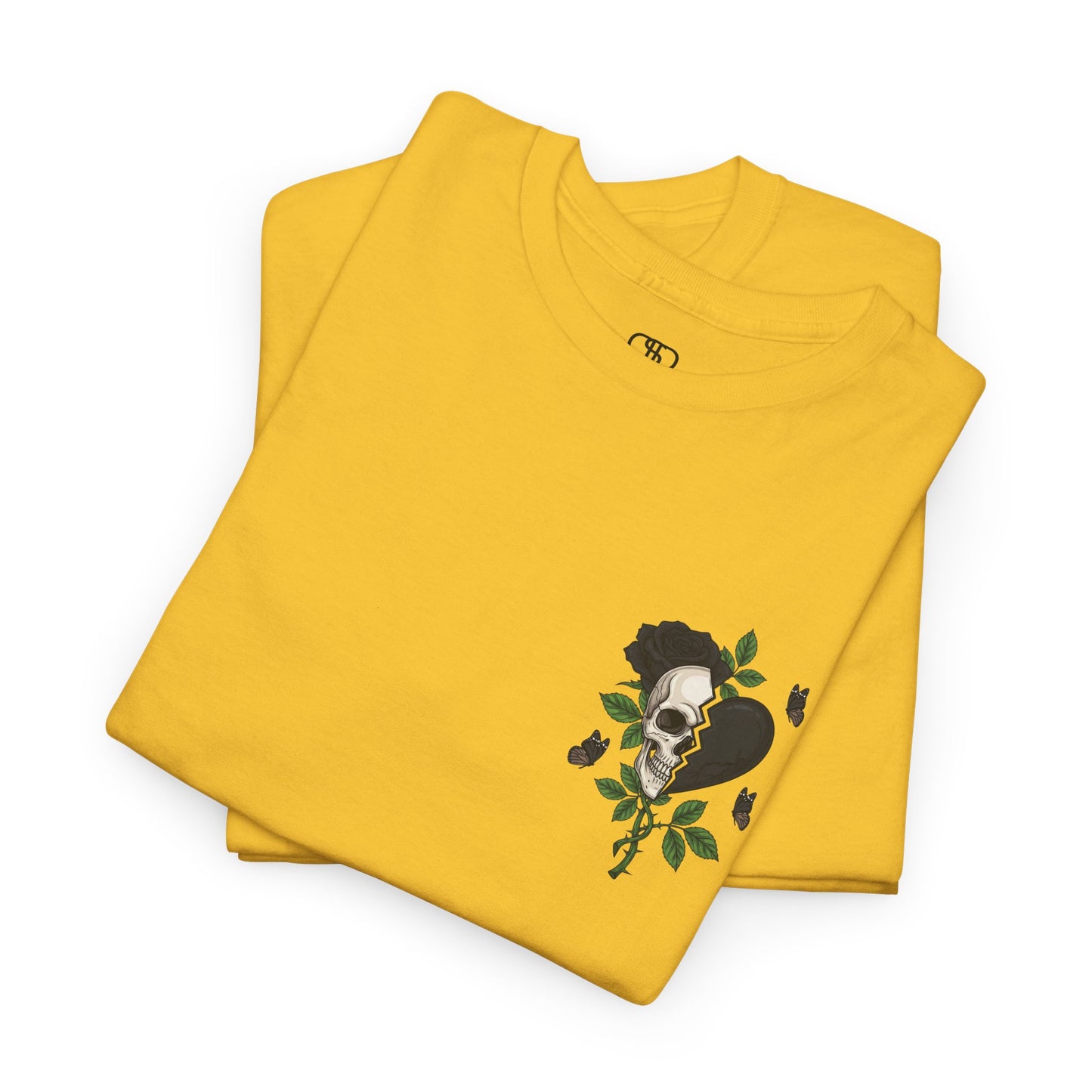A folded daisy t-shirt with a front design of a half skull, half broken heart, and a rose. The back reads "Gym Heals" in black.