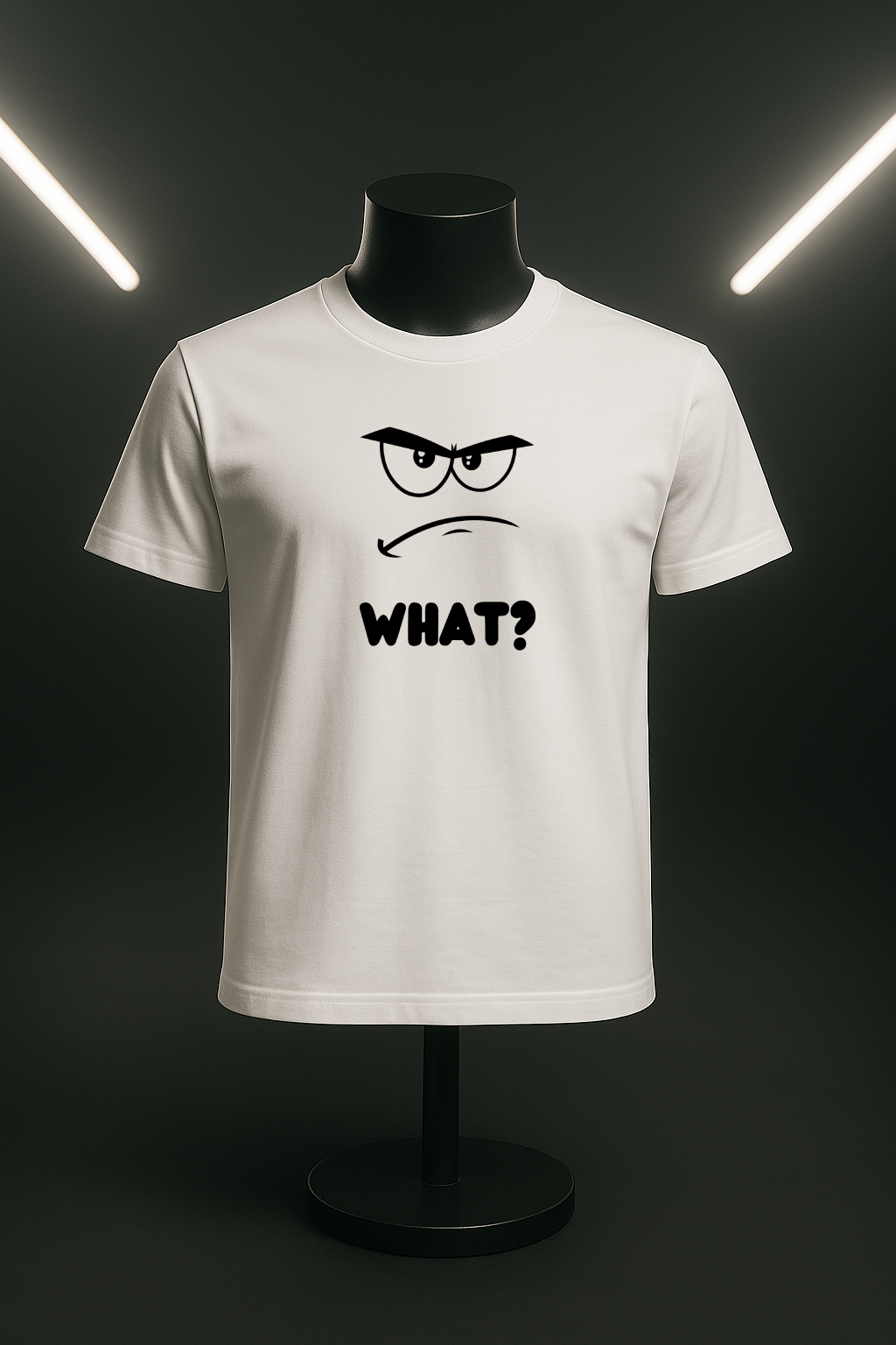 A t-shirt with a minimalist, faceless cartoon character showing an angry and confused expression. Below the character is the word 'WHAT?' in a bold font.