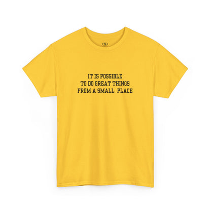 A daisy t-shirt with the quote “It is possible to do great things from a small place” on the front.
