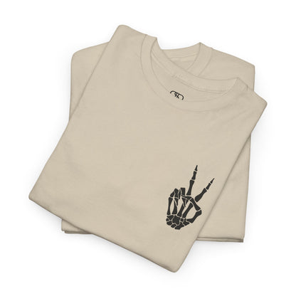 A [folded sand] t-shirt with a skeletal peace sign on the front and the phrase “Have the day you deserve” with a large skeletal peace sign on the back.
