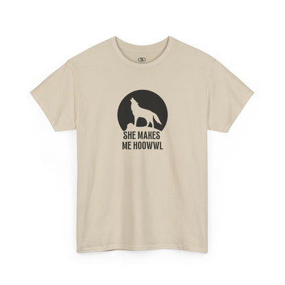 A sand colored T-shirt with a wolf silhouette howling at the moon on a cliff, and "She makes me HOOWWL" text.