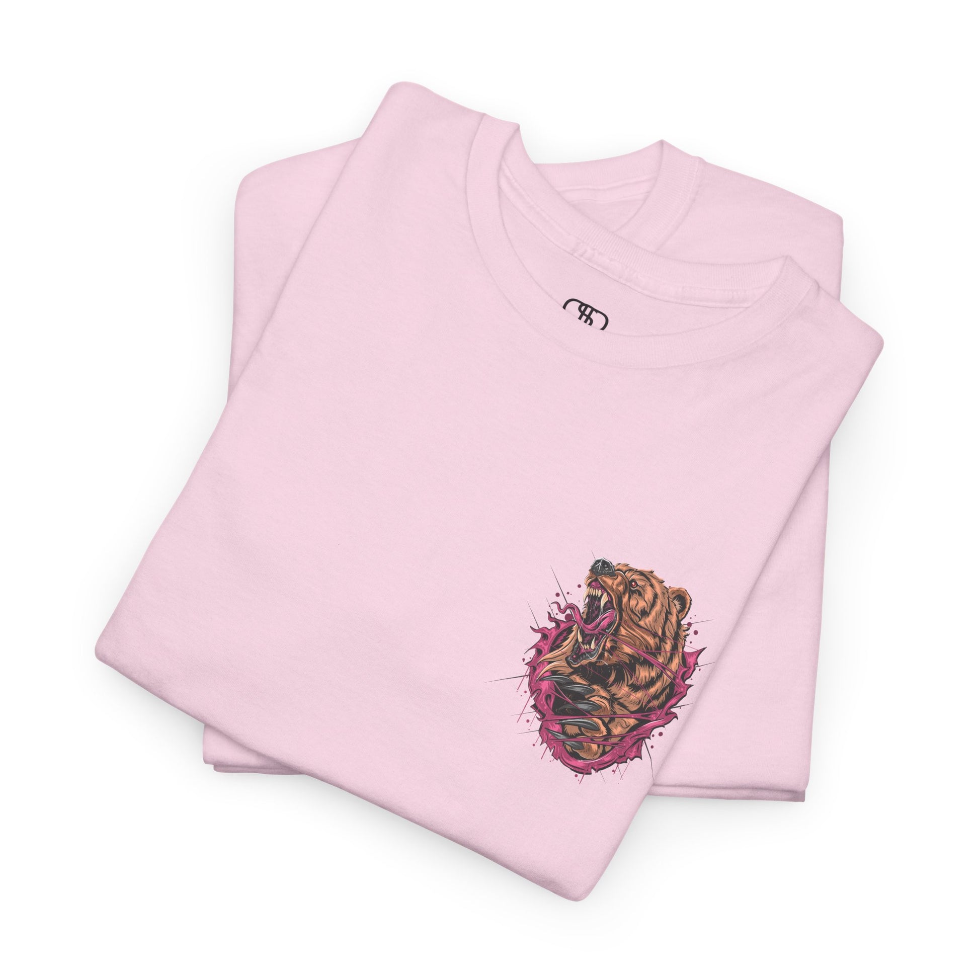 A folded light pink T-shirt with a graphic of a raging bear ripping through the fabric, growling, with claws out and red eyes.