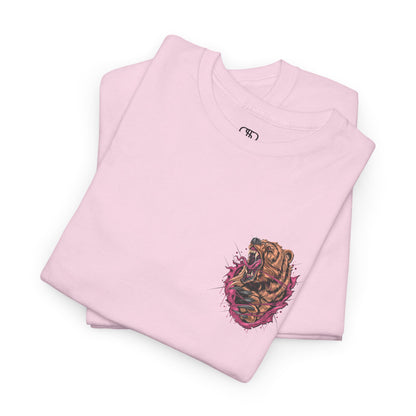 A folded light pink T-shirt with a graphic of a raging bear ripping through the fabric, growling, with claws out and red eyes.