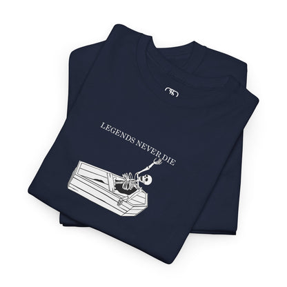A folded Navy T-shirt with a skeleton breaking free from a casket, reaching up towards "Legends Never Die" text.