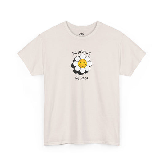 A vibrant yellow sunflower graphic on a t-shirt. The inspirational phrase “Be Present, Be Alive” is elegantly integrated into the design.