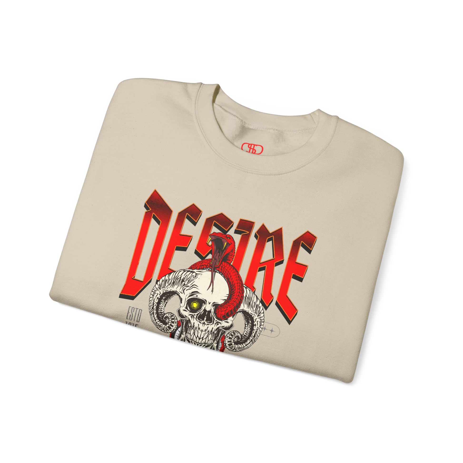 A folded sand sweatshirt Horned skull with glowing eye and red snake wrapped around it, "Desire Death's Touch" text, gothic sweatshirt design.