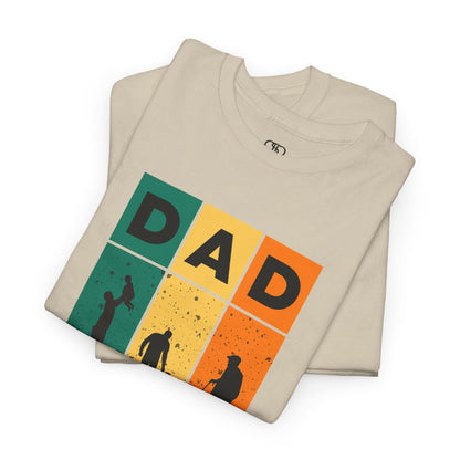 A folded sand T-shirt with "DAD" letters, each letter showing a different stage of a father's life (lifting child, walking with child, old age).