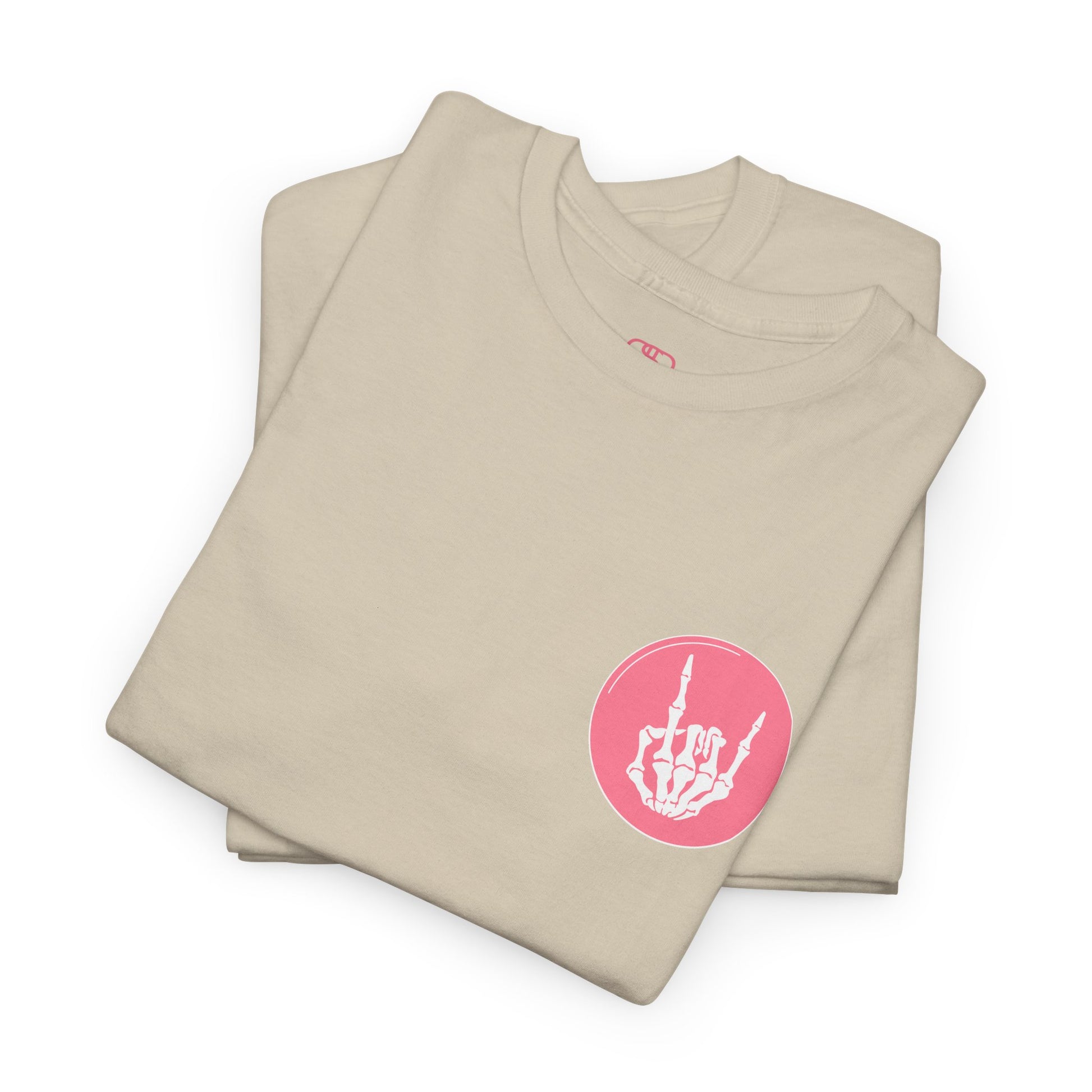 A folded sand t-shirt with a skeletal hand in a bubble on the front and the phrase “Sorry you’re intimidated by my resting Bitch ace I’m actually a fucking delight” on the back.