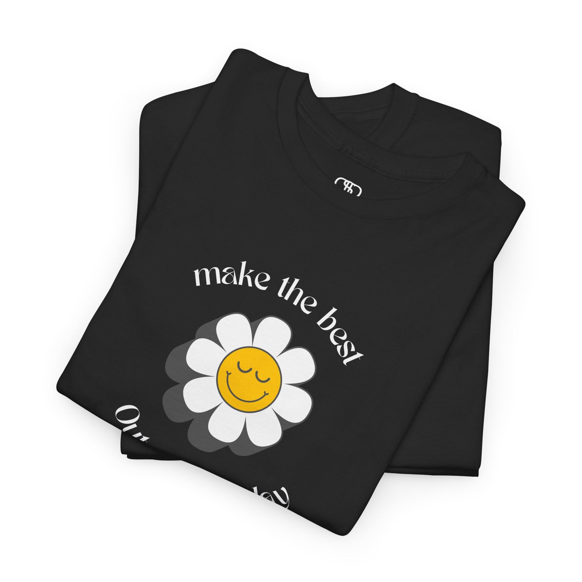A folded black t-shirt with a smiling sunflower and the words “Make the best out of Everyday” on the front and “Dear Person behind me, I’m glad that you are here” on the back.