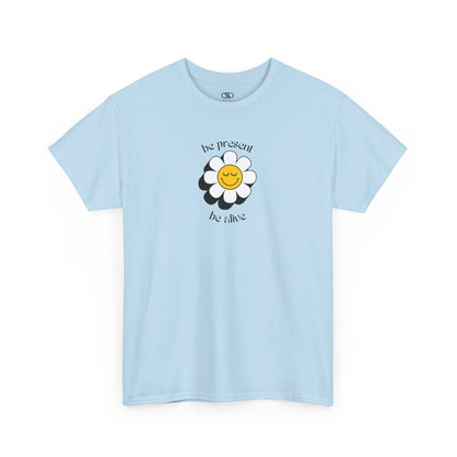 A vibrant yellow sunflower graphic on a t-shirt. The inspirational phrase “Be Present, Be Alive” is elegantly integrated into the design.