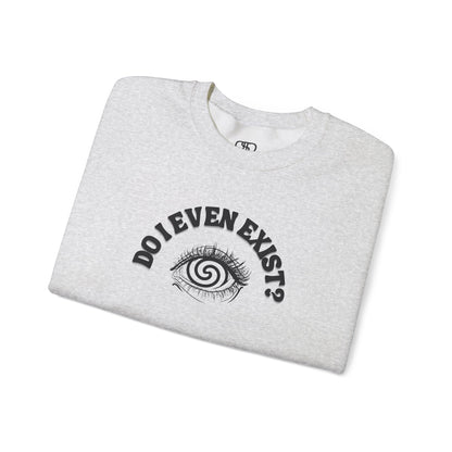 A folded Ash Gray sweatshirt with a graphic print of a detailed, realistic eye that contains an optical illusion of a spiral. The text "Do I even Exist?" is printed above the eye in a clean font.