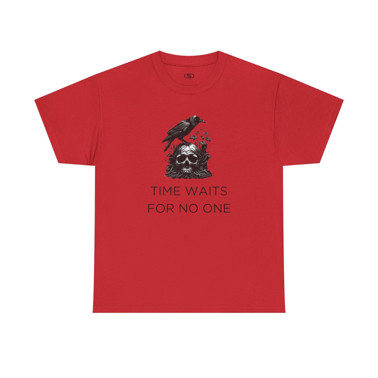 A close-up of a t-shirt with a gothic illustration. A black crow stands atop a weathered skull, which has moss and delicate vines growing through its eye sockets and around its form, blending nature and death.