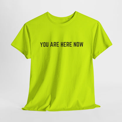 Front of a t-shirt with the grounding phrase "You are Here now" in a clean, minimalist font.