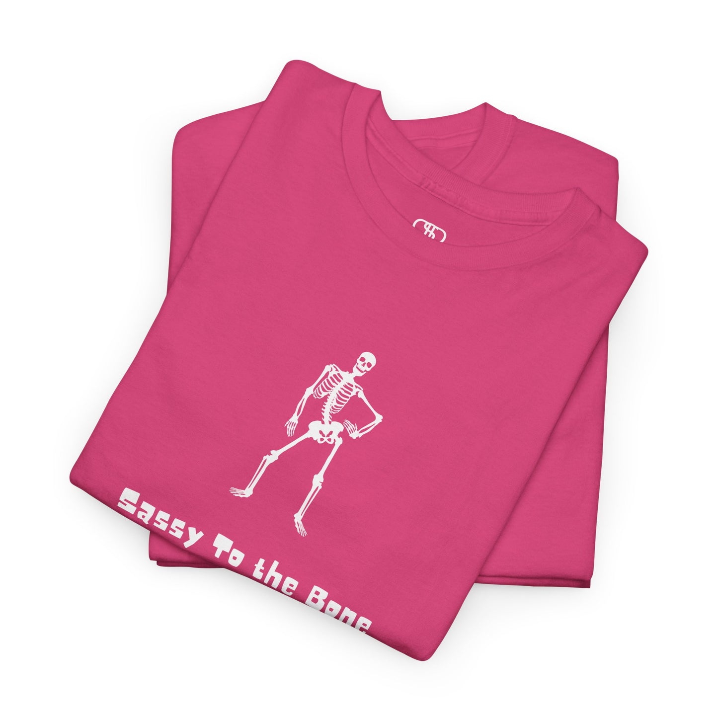 Folded Pink T-shirt with a sassy skeleton graphic with hands on hips and "Sassy to the Bone" text in a cartoon font.