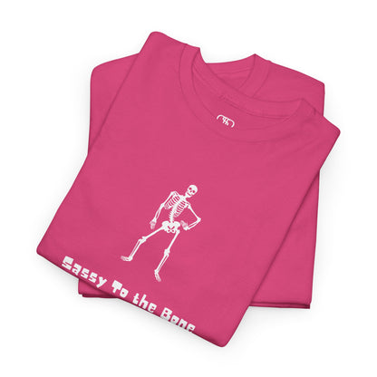 Folded Pink T-shirt with a sassy skeleton graphic with hands on hips and "Sassy to the Bone" text in a cartoon font.