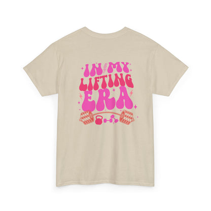 A sand t-shirt with a retro smiley face on the front and the phrase “In my lifting Era” in a creative retro design on the back.