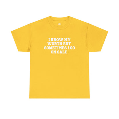 A [yellow] t-shirt with the funny quote "I know my worth but sometimes I go on sale" printed in a clean, black font across the chest.