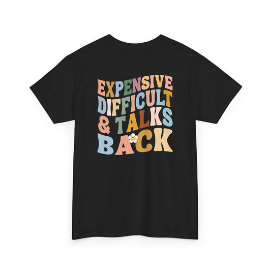 A black t-shirt with a melting emoji and the words “Expensive Difficult & Talks Back” on the front and the full phrase in a retro wavy font on the back.