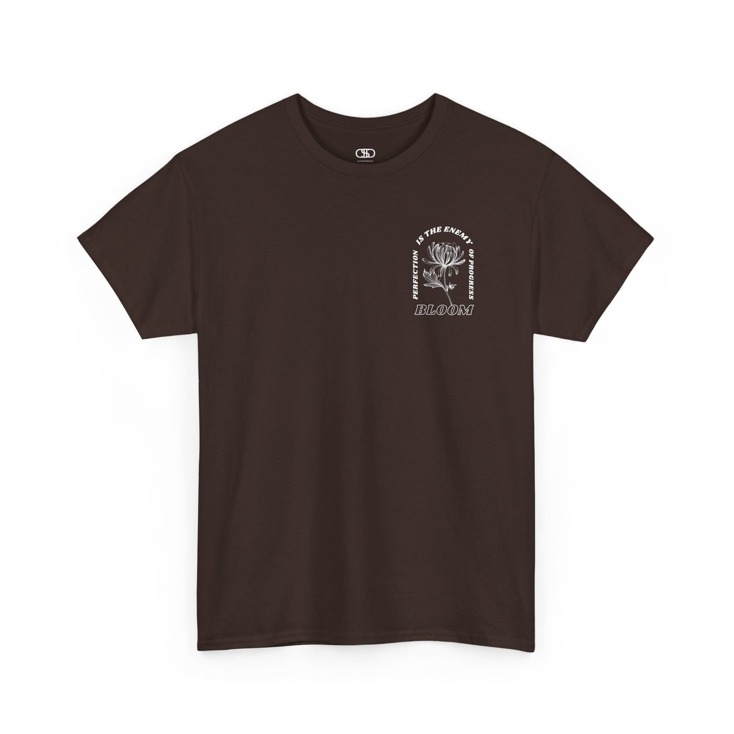 A [dark brown] t-shirt with a central flower design and the words “Perfection is the enemy of progress” and “Bloom” underneath it the phrase "Consistent effort breeds greatness." 