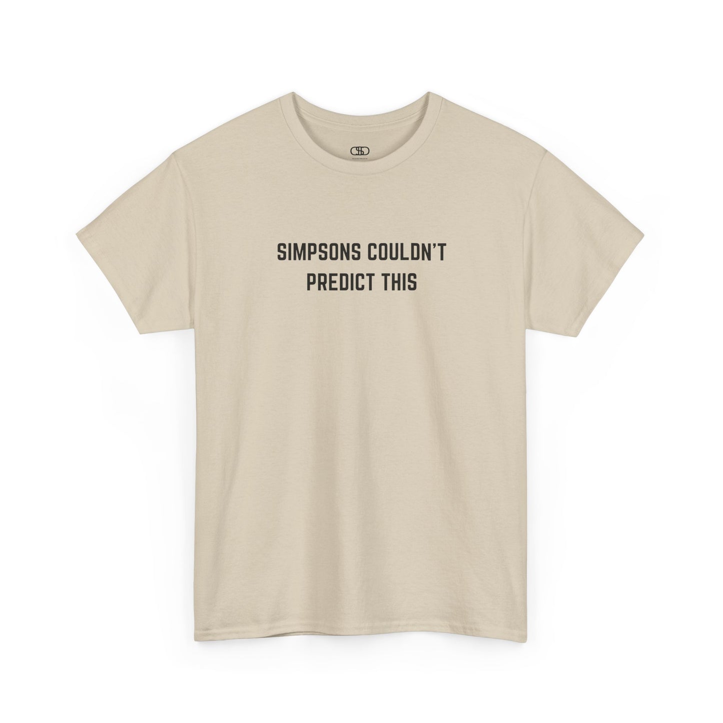 Beige t-shirt with black text 'SIMPSONS COULDN'T PREDICT THIS' on a white background