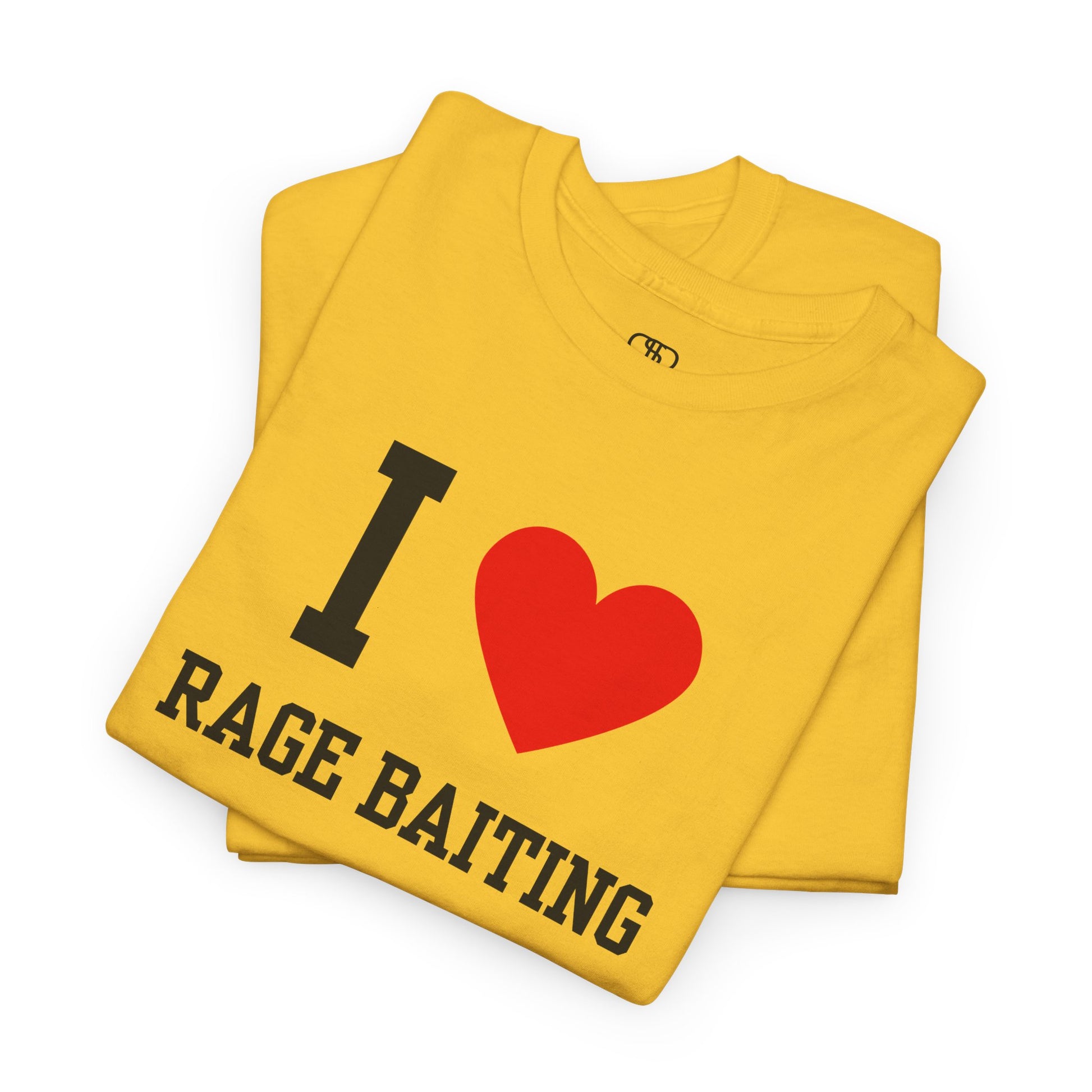 A folded golden t-shirt featuring the classic "I Love" graphic style with the text "I," a red heart, and the words "Rage Baiting" below it.