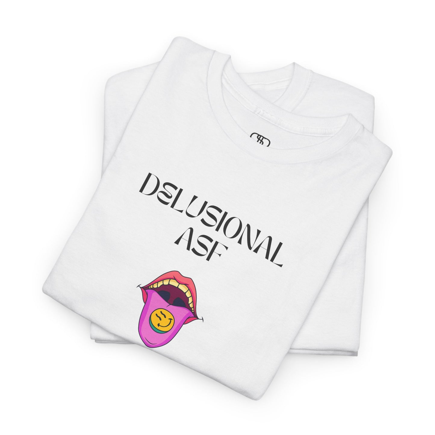 A folded white T-shirt with "Delusional asf" text, an open mouth graphic with tongue out, and a happy face emoji pill.