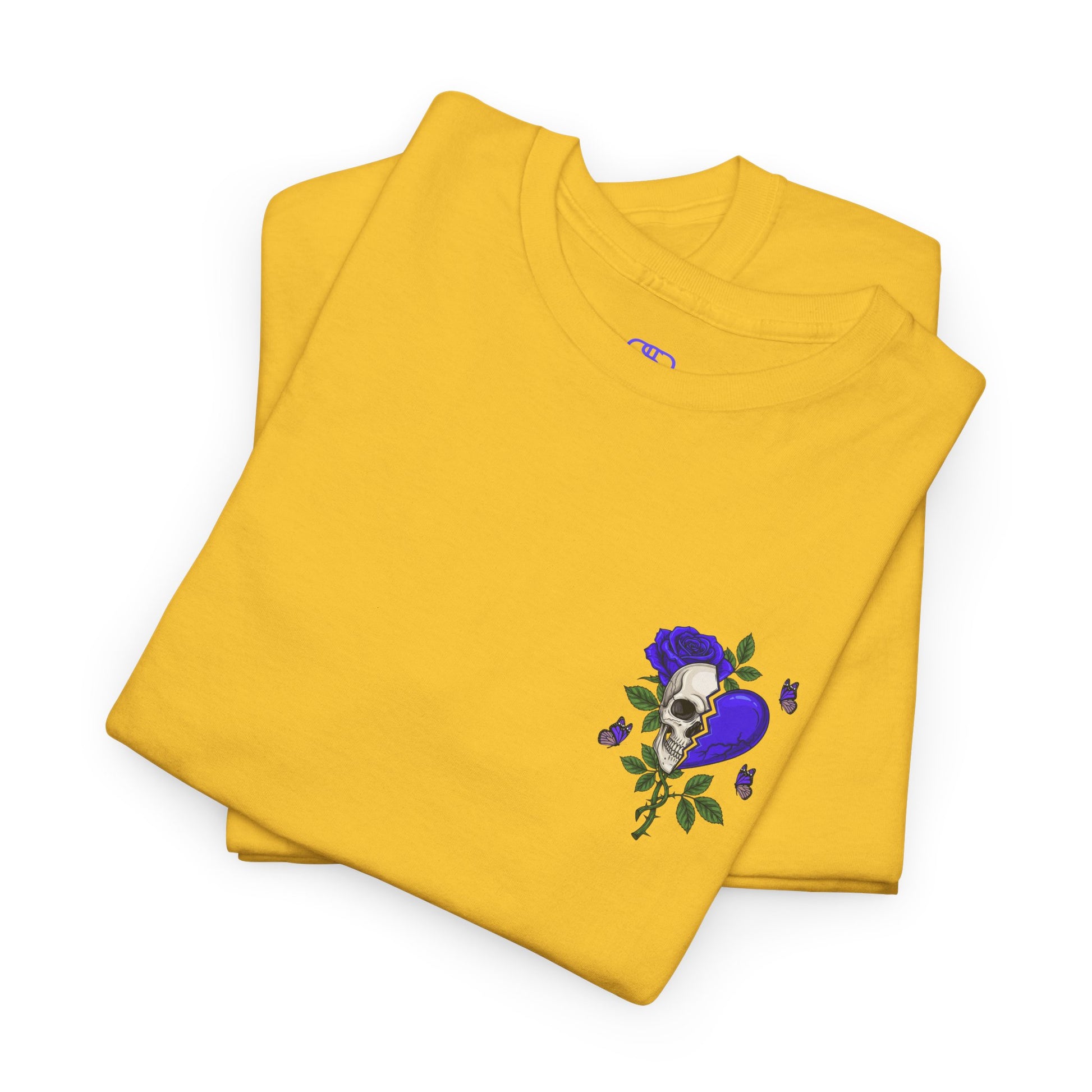 A folded daisy t-shirt with a front design of a half skull, half broken purple heart, and a rose. The back reads "Gym Heals" along with a similar design found on the front.