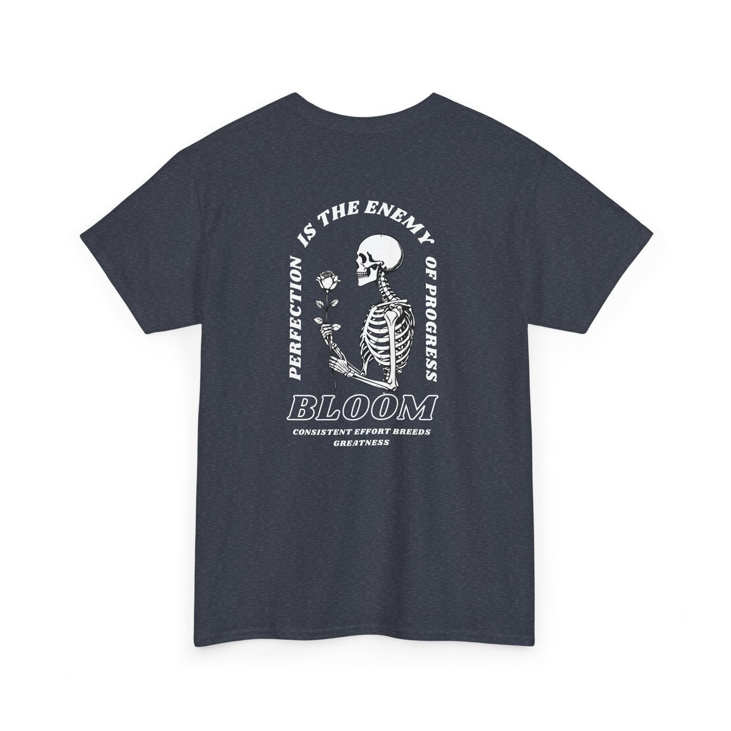 A [navy] t-shirt with a central skeleton and rose design and the words “Perfection is the enemy of progress” and “Bloom” on the front.