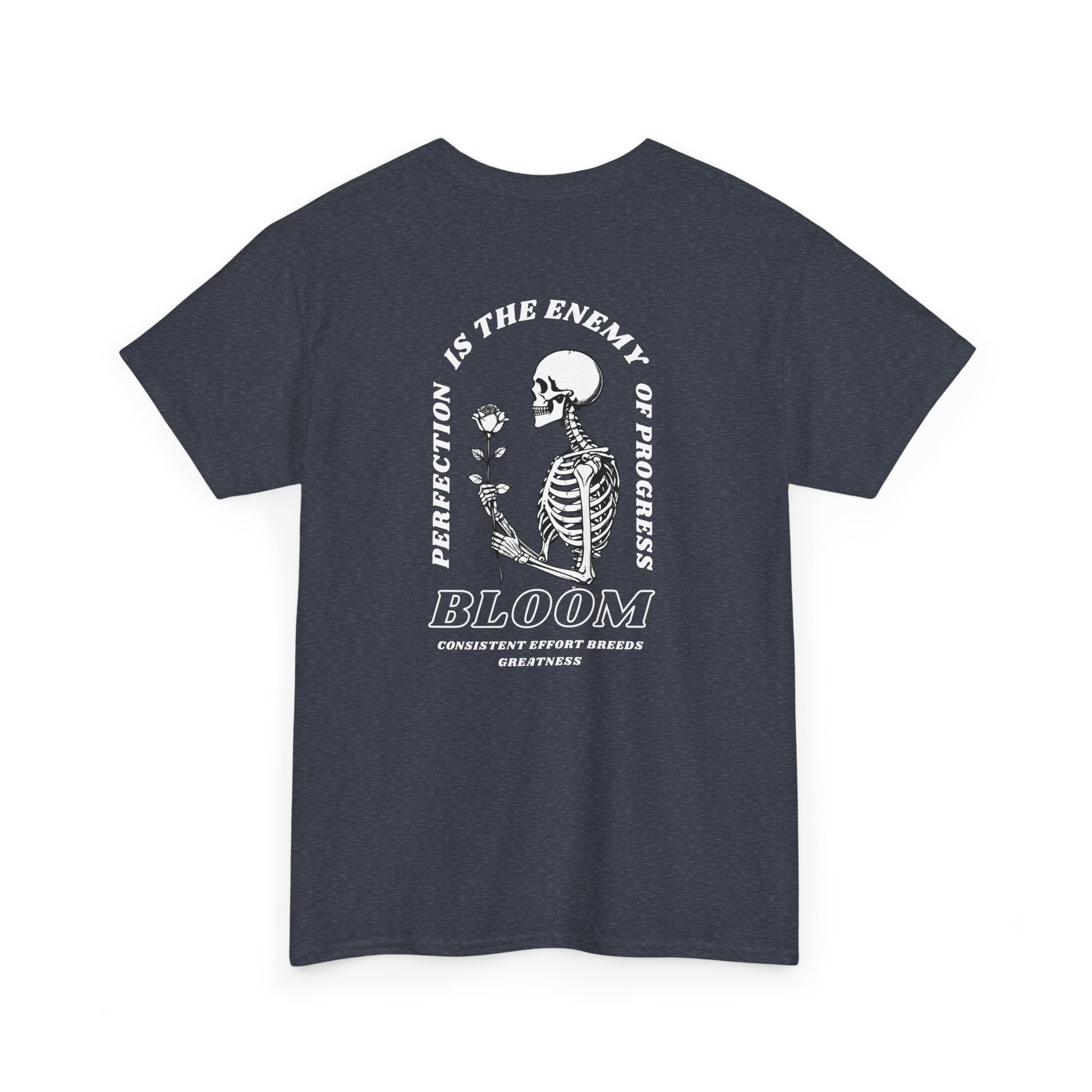 A [navy] t-shirt with a central skeleton and rose design and the words “Perfection is the enemy of progress” and “Bloom” on the front.
