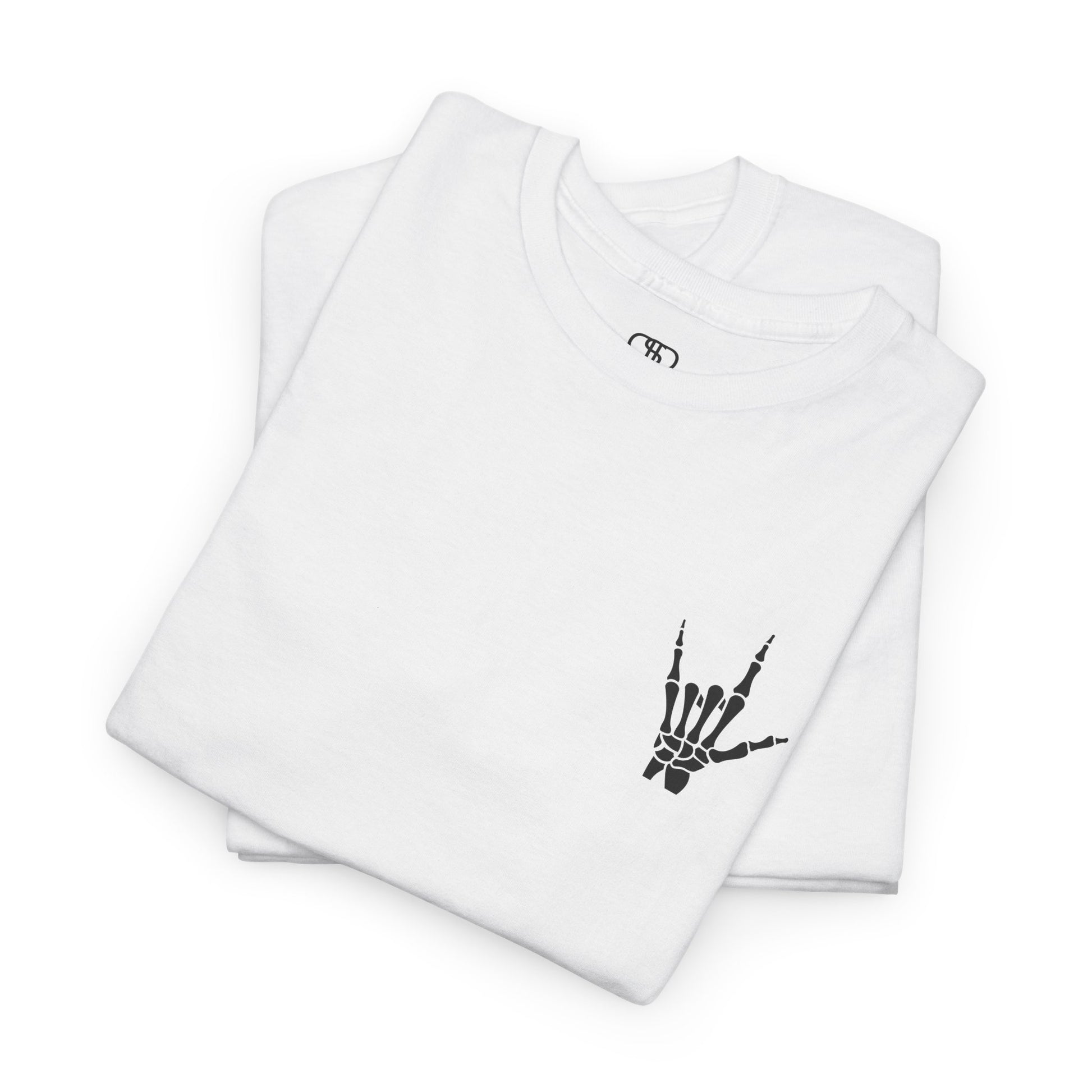 A folded white t-shirt with small rock hand symbol on front, and "Rules.. Never Heard of Them" graffiti text on the back.