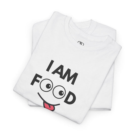 A folded white T-shirt with "I AM FOOD" text, where the 'OO' are cartoon eyes, and a tongue-out graphic.