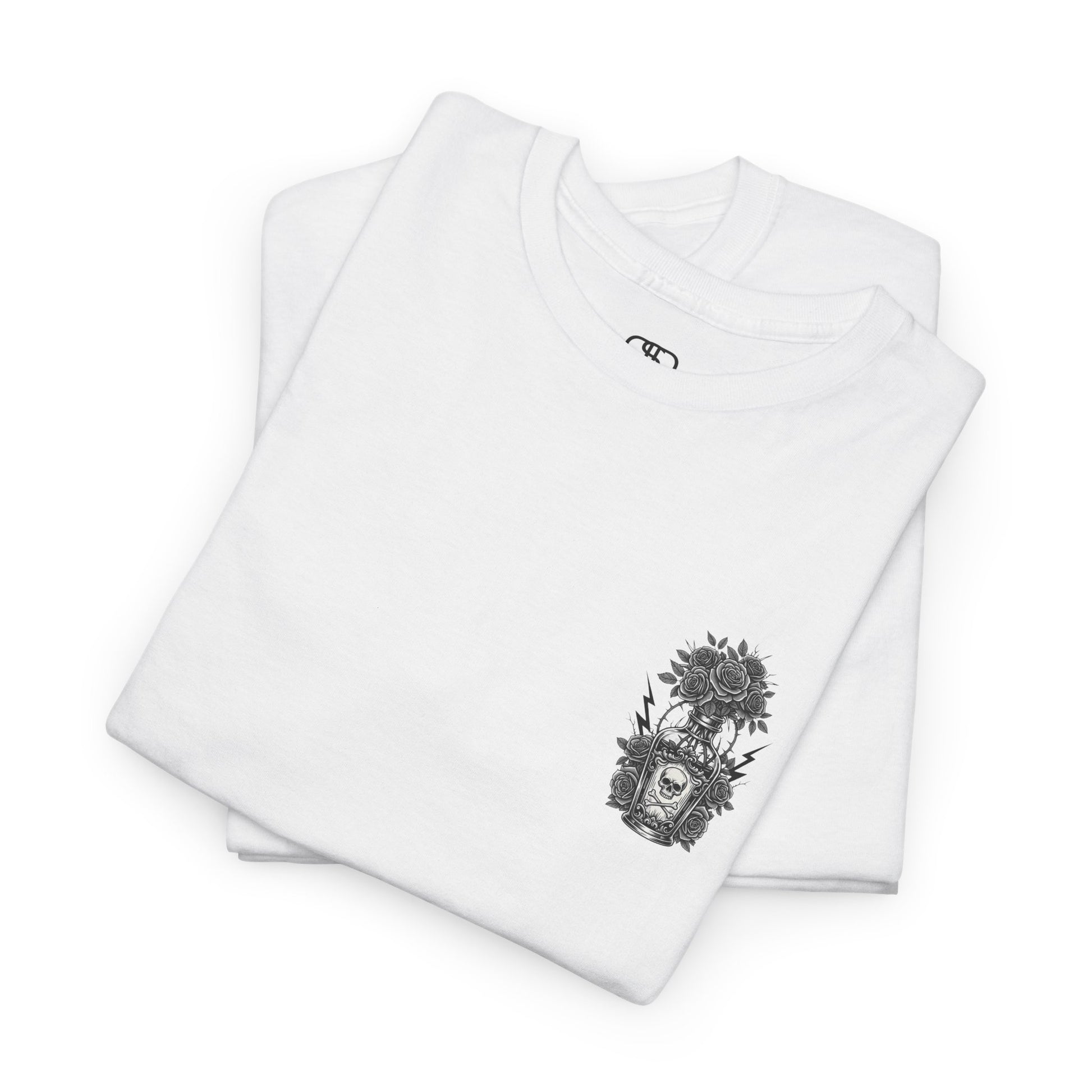 A folded white t-shirt with a skull and crossbones vase filled with roses and the words “Surviving Purely Out of Spite” in a gothic font.